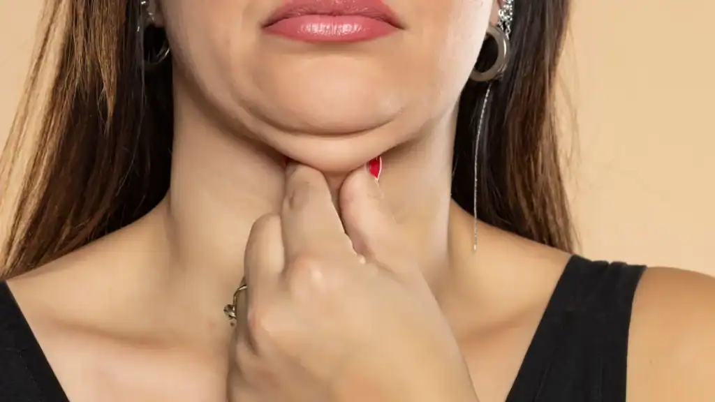 An image of a woman with double chin, sad, worried : Non Surgical Double Chin Removal Treatment in Witley, UK